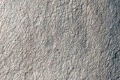 Triangular Scars on Hillslopes