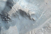 Crater-Related Pitted Materials in 3-Kilometer Crater in Nepenthes Planitia