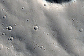 Channels Cutting across Troughs in Labeatis Fossae
