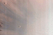 Well-Exposed Diverse Bedrock Associated with Crater off Her Desher Vallis
