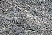 North-Pole-Facing Deposit in Crater Associated with Headwall Erosion