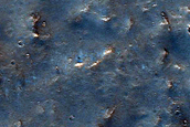 Possible Mafic Minerals on Tyrrhena Terra Crater Floor