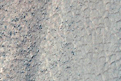 Triangular Scars on Hillslopes