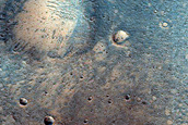 Small Fans and Narrow Channels in Crater Interior in Xanthe Terra