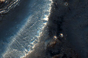 Channel Cutting Small Southern Mid-Latitude Crater