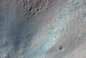 Crater with Prominent Ridge on Floor with Wall Erosion and Possible Gullies