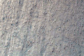 Triangular Scars on Hillslopes
