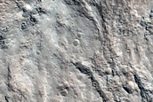 North-Pole-Facing Deposits in Two Craters