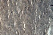 Layered Bedrock and Yardangs in Degraded Arabia Terra Crater