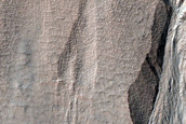 Triangular Scars on Hillslopes