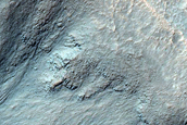 Possible Gully Associated Light-Toned Materials near Istok Crater